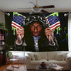 A large banner featuring a portrait of a man wearing a black hat and patriotic flags.