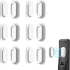 A set of magnetic silicone remote control holders in white and black.