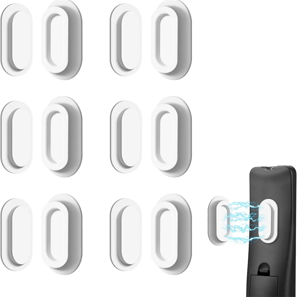A set of magnetic silicone remote control holders in white and black.
