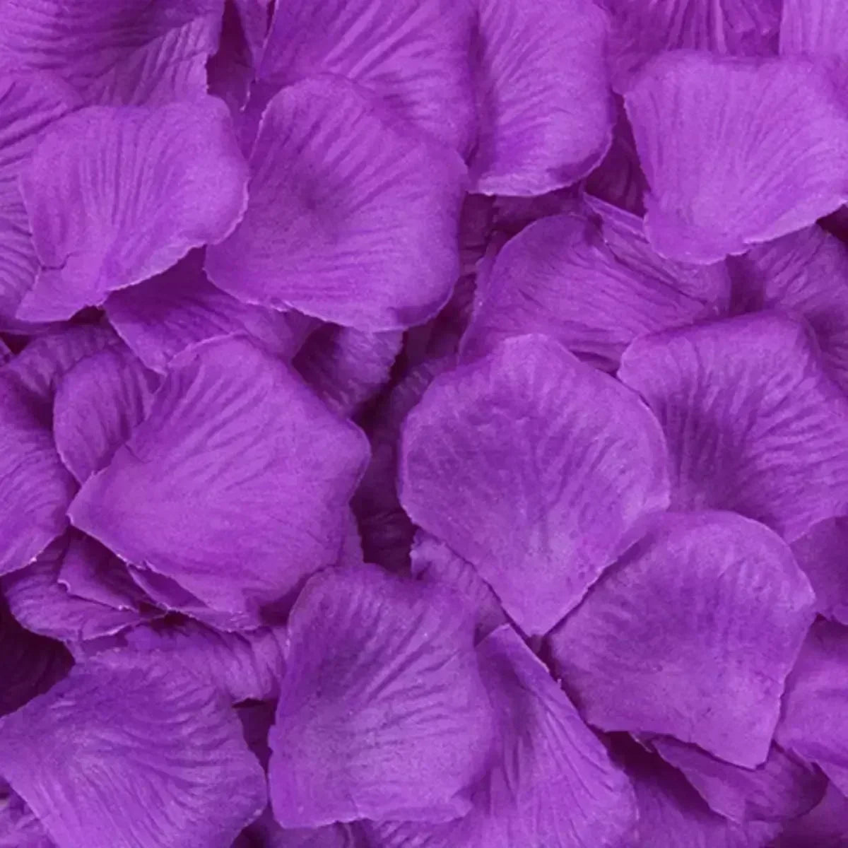 Close-up of vibrant purple silk rose petals for weddings and special events