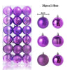 A box containing 36 purple and pink glitter Christmas tree ornament balls.