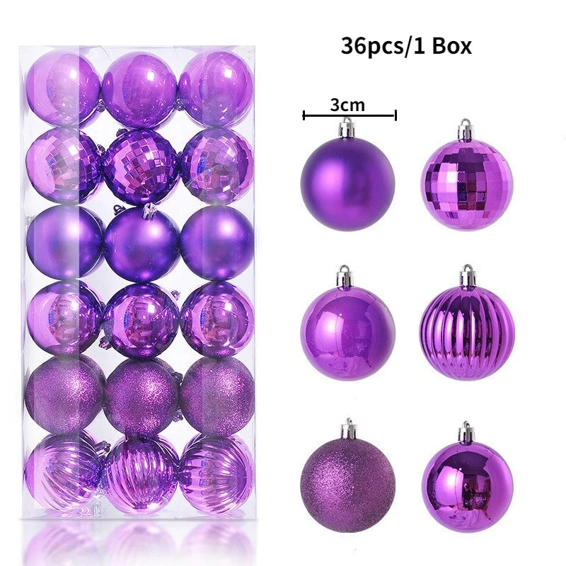 A box containing 36 purple and pink glitter Christmas tree ornament balls.