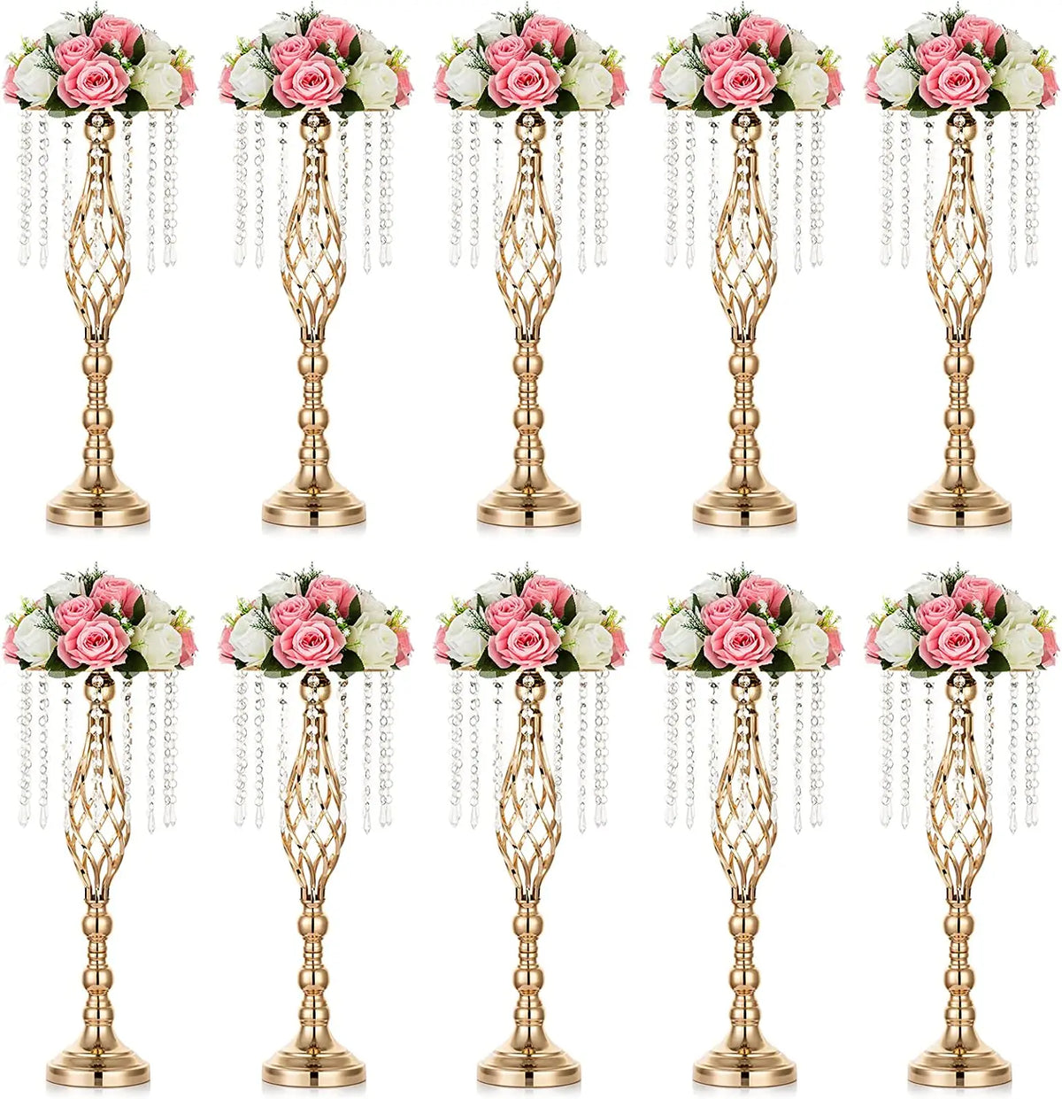 A set of gold crystal vases used for wedding centerpieces with pink and white floral arrangements.