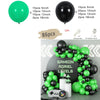 A balloon garland arch kit featuring black and green balloons with starburst accents, displayed on a gray background.
