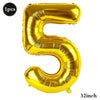 A shiny gold foil number balloon shaped like the numeral five, measuring 32 inches.