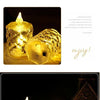 A close-up of several clear crystal LED candles glowing with a warm, realistic flickering light.