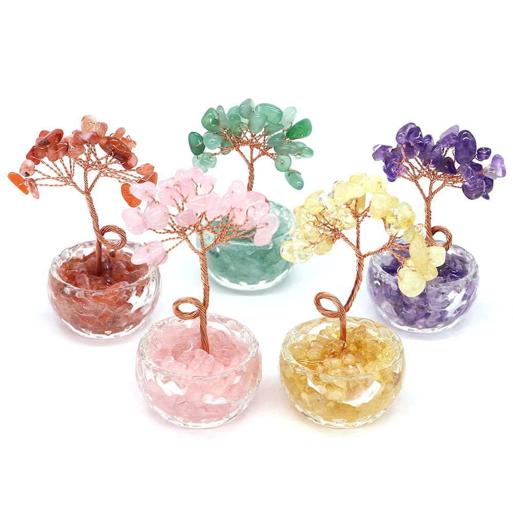 A collection of crystal healing gemstone bonsai trees in various colors including pink, green, purple, and yellow.