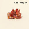 A cluster of reddish-orange jasper crystals displayed on a neutral background.