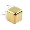 A square, gold-colored stainless steel ice cube with dimensions of 27mm on each side.