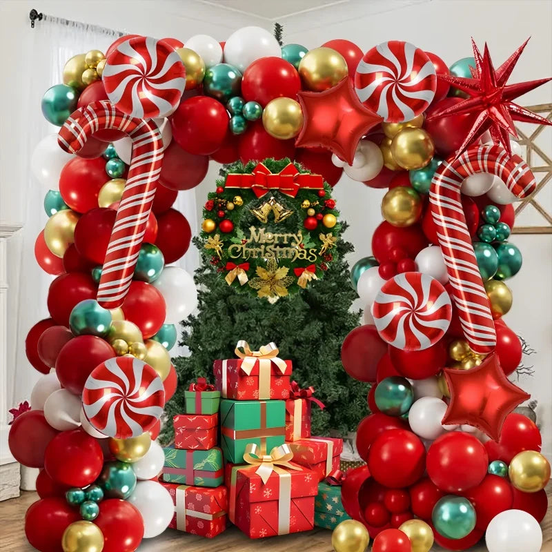 A festive balloon decoration set featuring red, gold, and green balloons arranged in an archway for holiday parties.