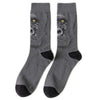 Gray crew socks featuring a print of a skull with glowing yellow eyes.