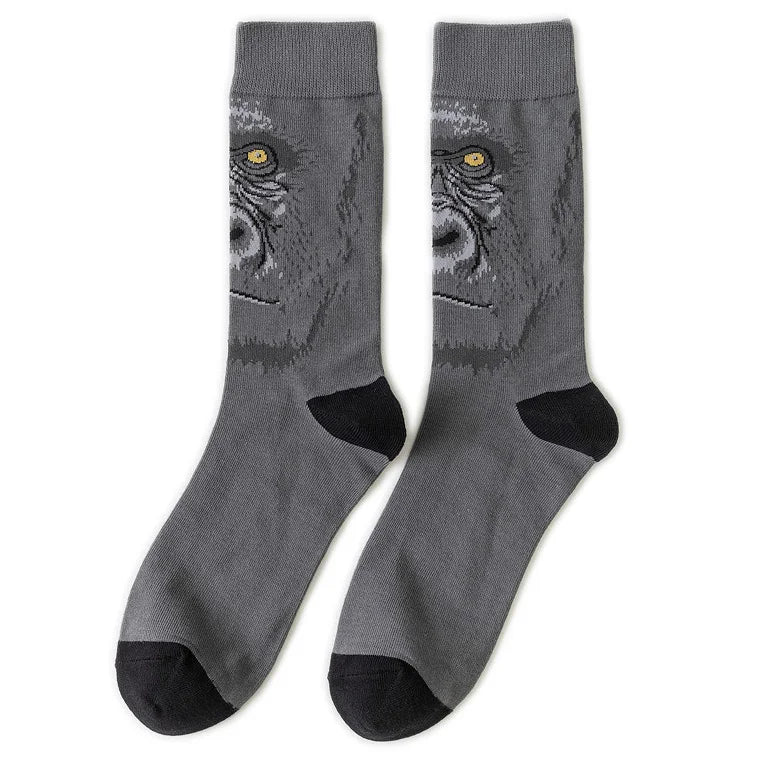 Gray crew socks featuring a print of a skull with glowing yellow eyes.