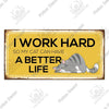 A rustic wooden sign with text that reads I WORK HARD SO MY CAT CAN HAVE A BETTER LIFE