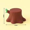A brown fondant cake topper shaped like a tree stump with green leaves, measuring 3.0cm high and 4.5cm wide.
