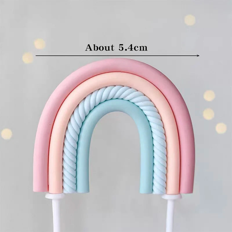 A rainbow-shaped cake topper set featuring pink and blue colors, measuring about 5.4cm.
