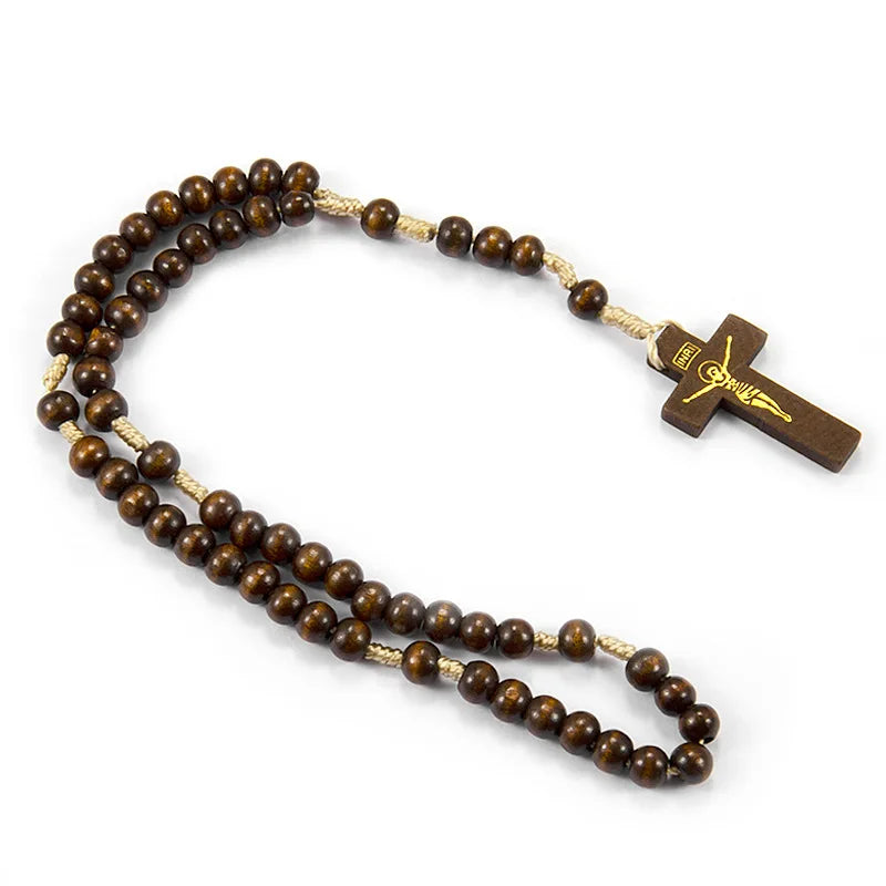 A wooden rosary beads necklace featuring a crucifix pendant on a string.