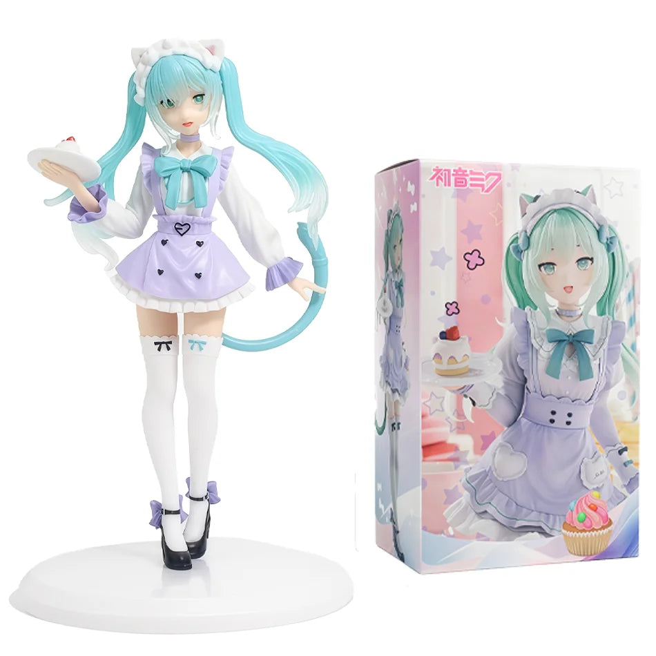 A PVC collectible figurine of Hatsune Miku in a white and purple outfit with teal hair, displayed on a round base.