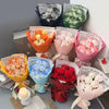 A collection of artificial rose flower bouquets in various shades of pink, orange, and white.