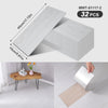 A package of 32 wood grain peel-and-stick floor and wall stickers, showing the individual sheet size.