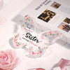 Pink butterfly acrylic keepsake gift for sister or best friend resting on a white surface.