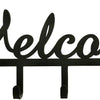 Black decorative metal wall-mounted key holder with seven hooks.