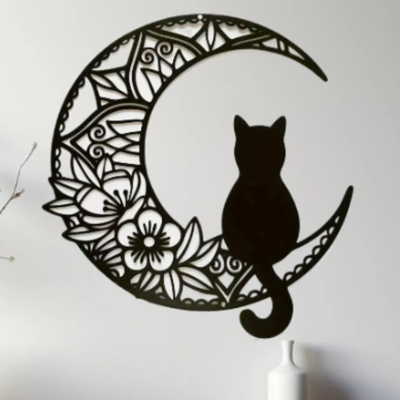 Black metal silhouette of a cat inside a crescent moon design wall decor