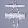 Ivory lace bowknot bridal garter set featuring delicate white lace and ribbons