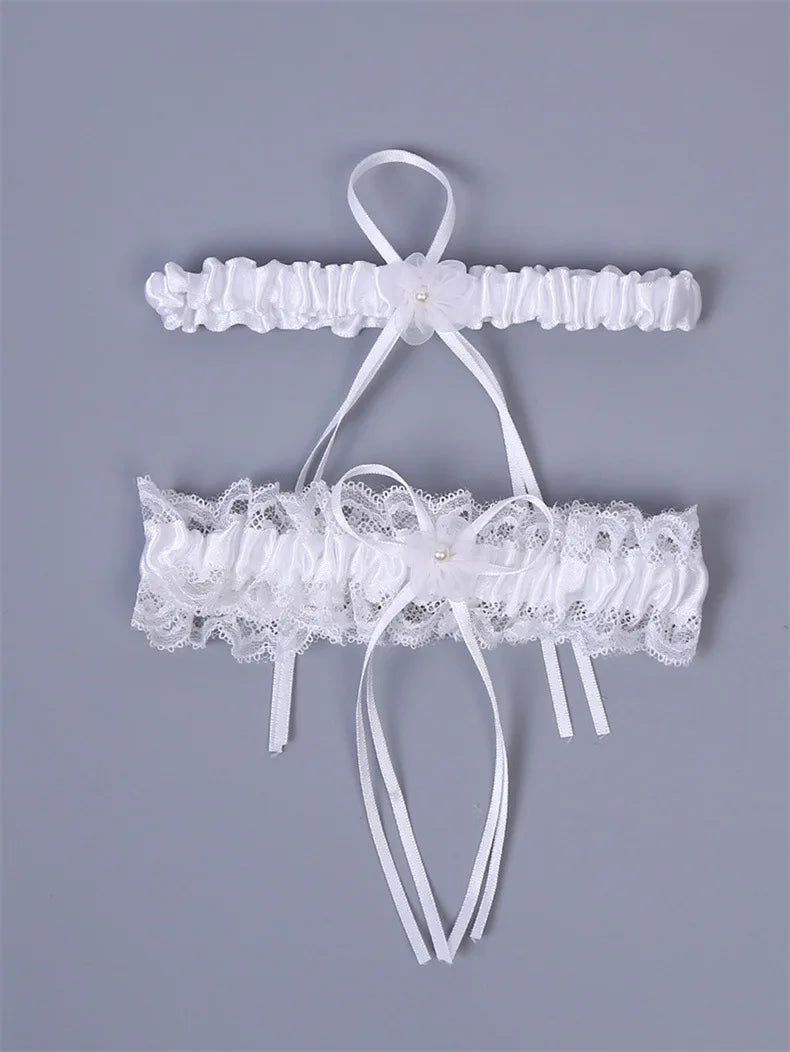 Ivory lace bowknot bridal garter set featuring delicate white lace and ribbons