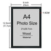 A black wooden picture frame with an A4 photo size insert and a wood material label.