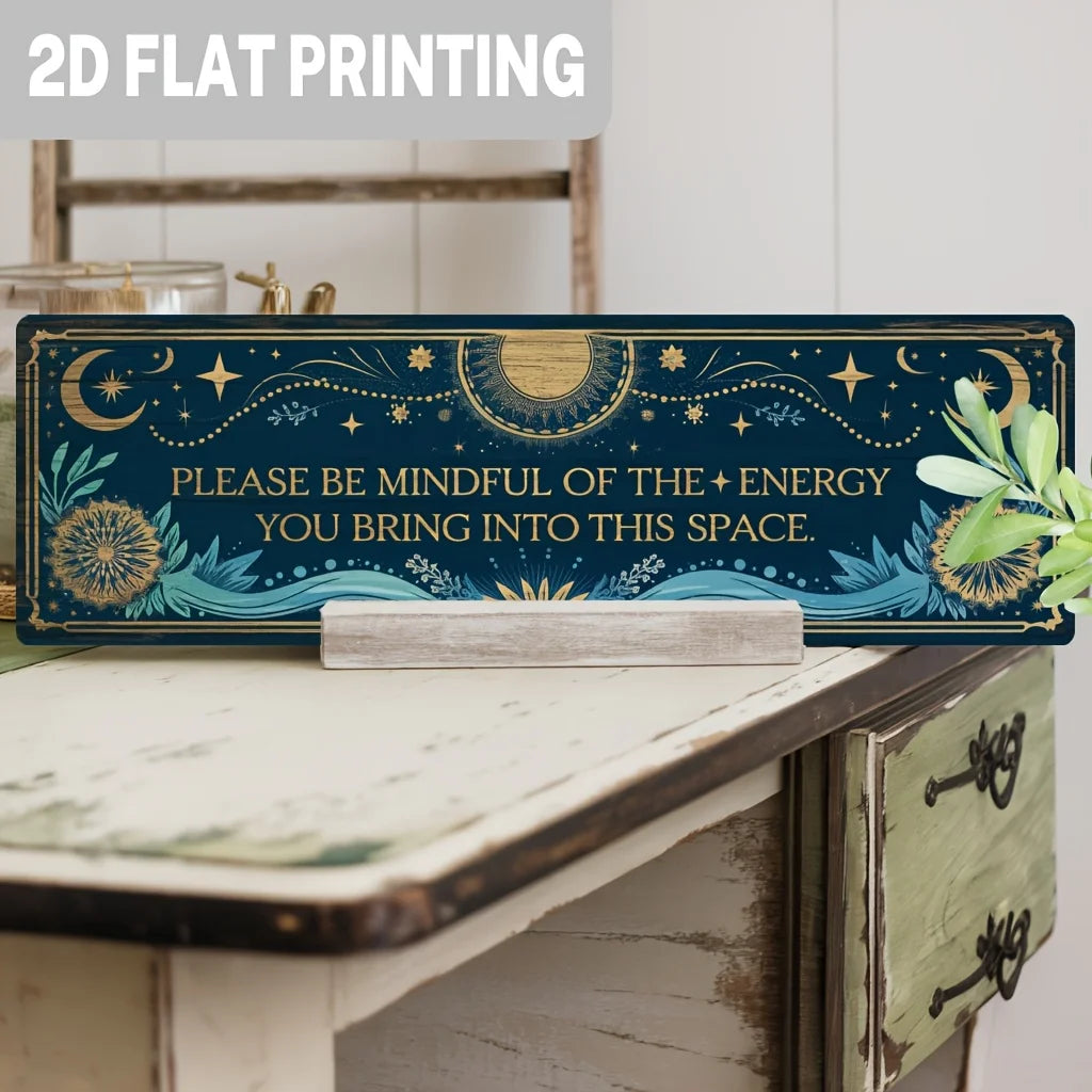 A rectangular metal tin sign with a dark blue background featuring celestial designs and text about energy.