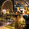 A display of solar-powered fairy string lights decorating a wooden archway and outdoor area.