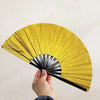 A hand fan made of glitter holographic material is shown opening to display radiating lines.
