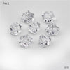 A collection of clear, faceted crystal ice cube acrylic stones for decorative use.