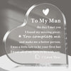 A clear acrylic heart keepsake plaque engraved with a message to her man