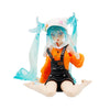A PVC collectible figurine of Hatsune Miku in an orange outfit with black overalls and a white hat