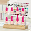 A transparent acrylic display board showing various nail shapes like round, square, arrow, and stiletto on a wooden base.