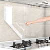 A hand is touching a clear oil-proof self-adhesive film applied to a kitchen wall surface.