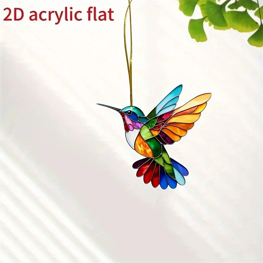 A colorful acrylic hummingbird suncatcher hanging ornament with iridescent wings.