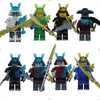 A collection of golden ninja building block figures in various poses and colors.
