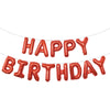 A string of red foil letter balloons spelling out Happy Birthday for party decoration.