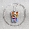 A sparkling acrylic pendant necklace featuring a Yorkshire Terrier charm on a silver chain.
