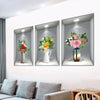 Trois autocollants muraux encadrés avec des bouquets de fleurs fraîches de diverses couleurs et arrangements.