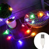 String lights with star-shaped LEDs illuminating a woven basket and a white mug