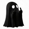A black ghost figurine with an eerie face making a sassy hand gesture.