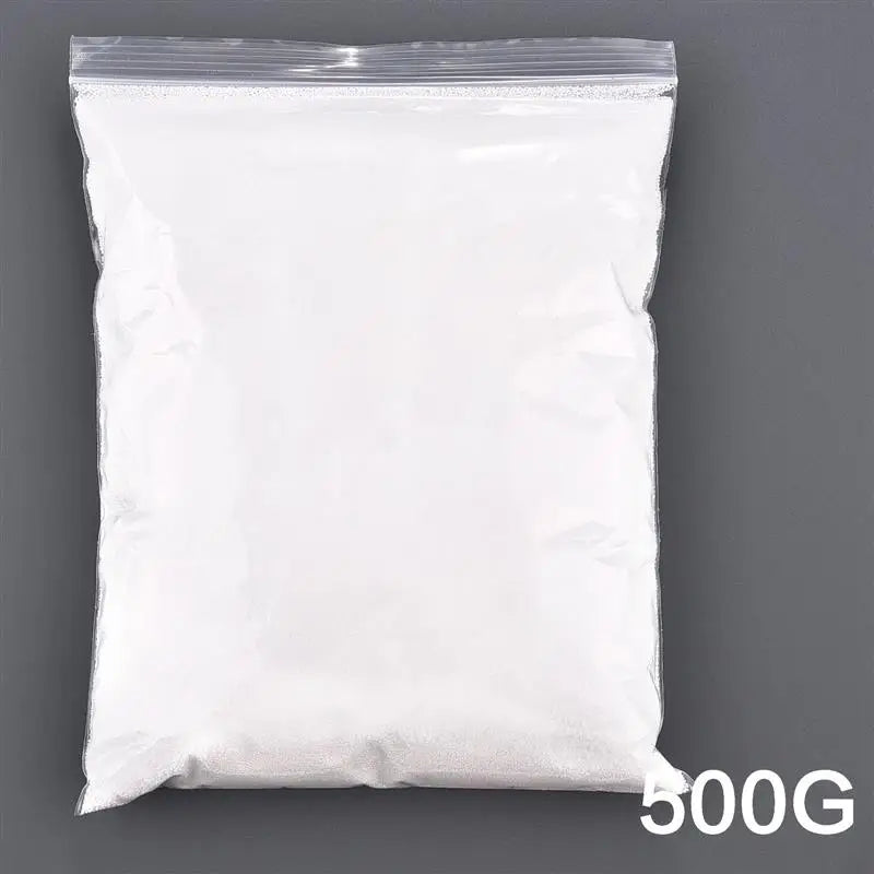 A white plastic bag filled with candle wax and sand pigment.