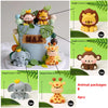 A set of animal cake toppers featuring a lion, monkey, and elephant in various colors and sizes.