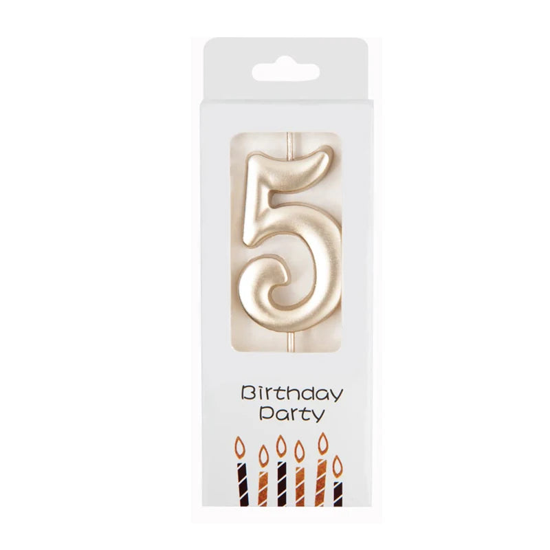 Gold number candle shaped like the number five for birthday party decor