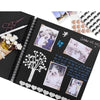 A black scrapbook album featuring various photos and decorative elements like leaves, hearts, and a vintage scissor.
