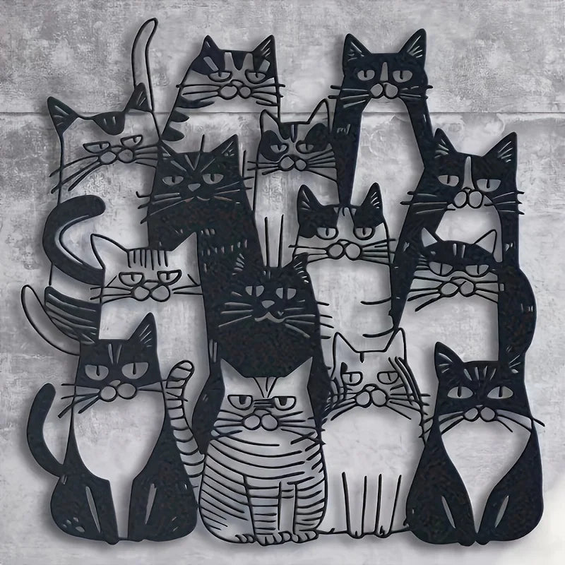 A black silhouette line art of multiple cats arranged in a playful, overlapping pattern.