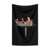 A black fabric tapestry featuring a depiction of a burning flag or banner.